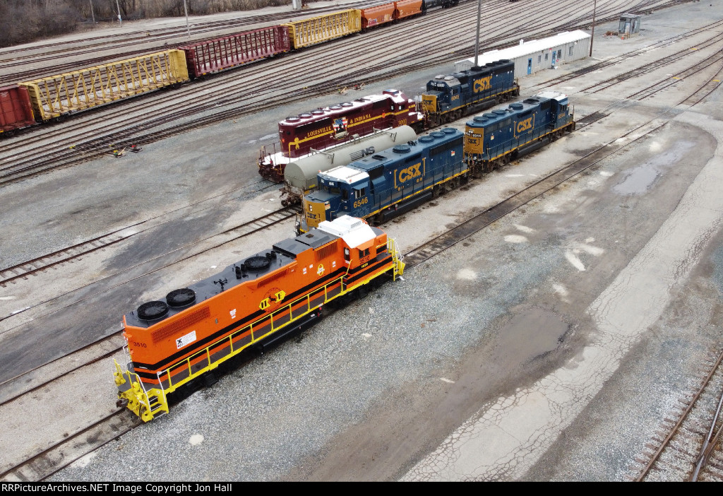 Waiting for paperwork that will determine its destination, HESR 3510 sits in the yard by other units